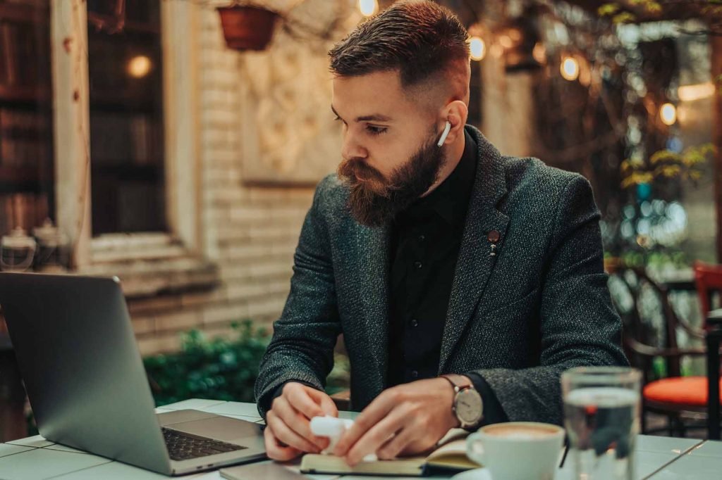 Men Use Laptop For Website Browsing